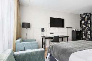 TV a/nebo společenská místnost v ubytování Best Western Plus Grand Hotel Elektra