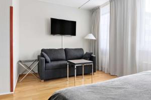 TV a/nebo společenská místnost v ubytování Best Western Plus Grand Hotel Elektra
