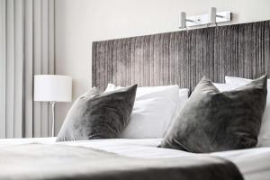 Postel nebo postele na pokoji v ubytování Best Western Plus Grand Hotel Elektra
