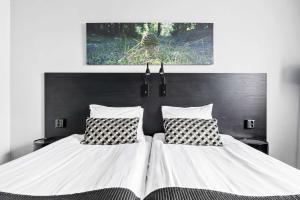 Postel nebo postele na pokoji v ubytování Best Western Plus Grand Hotel Elektra