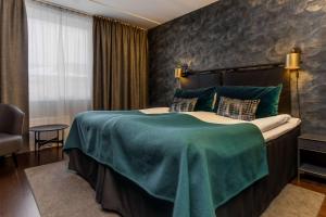 Postel nebo postele na pokoji v ubytování Best Western Plus Grand Hotel Elektra