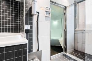 Koupelna v ubytování Best Western Plus Grand Hotel Elektra