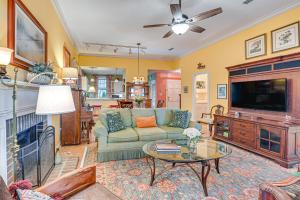 a living room with a couch and a tv at Riverside Cottage Close to Ocean and Myrtle Beach in Murrells Inlet