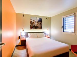 Krevet ili kreveti u jedinici u okviru objekta ibis Styles Lyon Centre Confluence