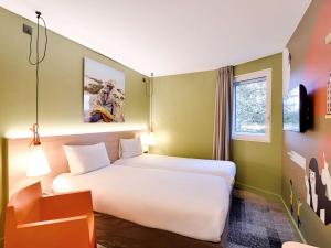 Krevet ili kreveti u jedinici u okviru objekta ibis Styles Lyon Centre Confluence