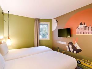 Krevet ili kreveti u jedinici u okviru objekta ibis Styles Lyon Centre Confluence