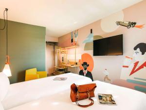 Krevet ili kreveti u jedinici u okviru objekta ibis Styles Lyon Centre Confluence