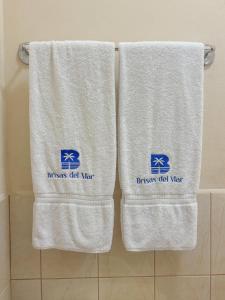 two towels on a rack in a bathroom at St. Regis Suite in San Juan del Sur