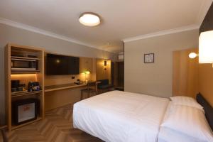 Mu S Boutique Motel "Matthew Flinders"客房内的一张或多张床位