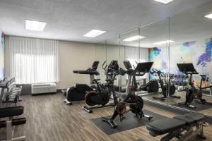 a gym with treadmills and ellipticals and mirrors at Hyatt Place El Paso Airport in El Paso