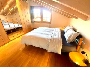 Postel nebo postele na pokoji v ubytování Heidahüs Penthouse