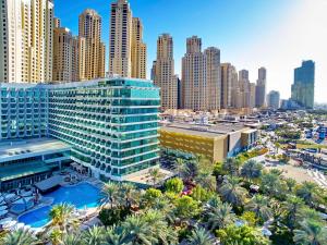 an aerial view of a city with tall buildings at Hilton Dubai Jumeirah in Dubai