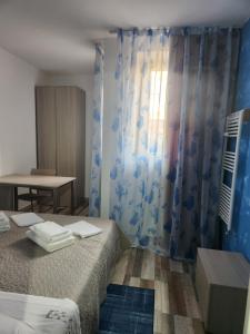 Postel nebo postele na pokoji v ubytování Casa Roxana