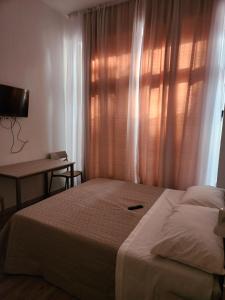Postel nebo postele na pokoji v ubytování Casa Roxana