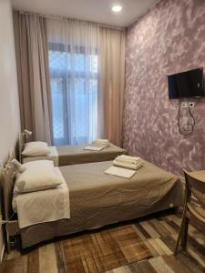 Postel nebo postele na pokoji v ubytování Casa Roxana