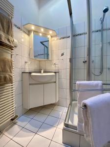 Koupelna v ubytování Heidahüs Penthouse + 10 fotografií