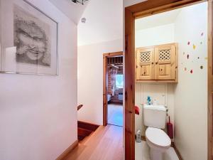 a bathroom with a toilet and a sink at Chalet Les Elfes - Chalet Les Elfes — Luxe et confort pour un séjour MAE-7361 in Les Allues +9 photos