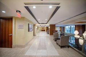 a hallway of a hospital with chairs and a lobby at Hilton Garden Inn Bethesda Downtown in Bethesda