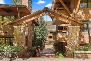 an entrance to a house with a wooden archway at Aspen Condo W Pool, Hot Tub & 2 Blocks To Gondola - Fh4 in Aspen