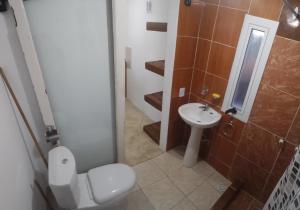 a bathroom with a toilet and a sink at Casa Praga in Ostende