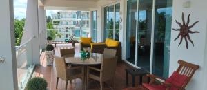 a patio with a table and chairs on a balcony at Sandy Shores in Nilaveli