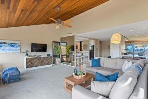 a living room with a couch and a ceiling fan at WAILEA ELUA, #0802 condo in Wailea