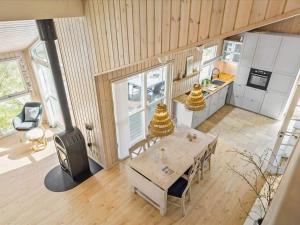 an overhead view of a kitchen with a table and a stove at Tranquil Haven in Lyngsa - By Traum Ferienwohnungen in Sæby