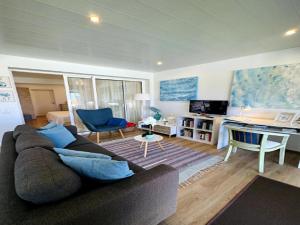 a living room with a couch and a table at Holiday home in Porto da Cruz with garden in Porto da Cruz