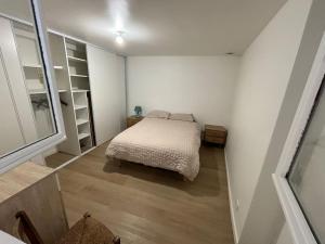 Ένα ή περισσότερα κρεβάτια σε δωμάτιο στο Charmant appartement cosy