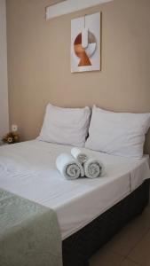 Postel nebo postele na pokoji v ubytování Costa Suítes + 78 fotografií