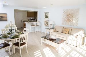 a living room with a couch and a table at Venice on the Beach Hotel in Los Angeles