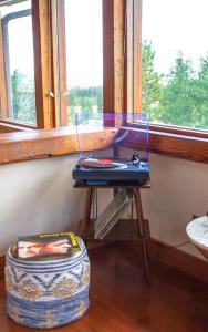 a table in a room next to a window at Fairplay Coyote Cabin in Fairplay