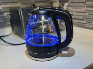 a blue glass jug sitting on top of a counter at Modern condo near Fremont Street in Las Vegas