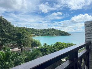 a view of the ocean from a balcony at Ao Prao Resort in Ko Samed