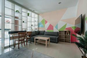 a living room with a couch and a table at Lux apartments TOP in Koh Samui