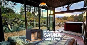 a screened in porch with a fireplace and a view at Animal trail in Sandnes