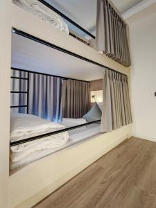Postel nebo postele na pokoji v ubytování YAA Hostel