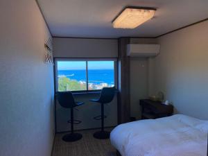 Ένα ή περισσότερα κρεβάτια σε δωμάτιο στο Tainan House Awaji