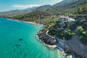 an aerial view of a beach with a house at Azure in Kallirakhi