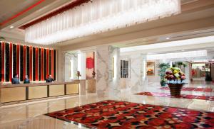 a lobby of a hotel with a large lobby at Solaire Resort Entertainment City in Manila