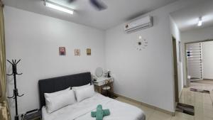 Postel nebo postele na pokoji v ubytování EnL Homestay ALANIS Residence