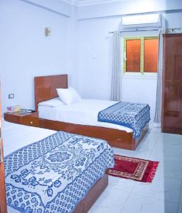 Postel nebo postele na pokoji v ubytování Niber Guest House