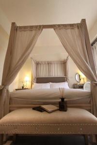 a bedroom with a large bed with a canopy at Yuncourt B&B in Jian