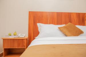 Postel nebo postele na pokoji v ubytování Flamarc Hotel