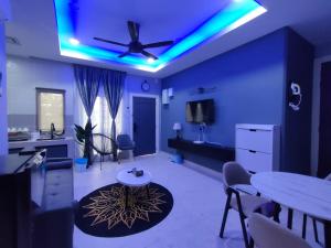 a living room with a ceiling with blue lights at Delle Home in Petaling Jaya