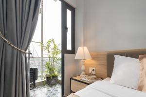 Voodi või voodid majutusasutuse Gia Nguyễn Hotel Dalat toas