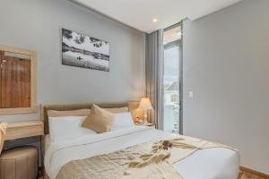 Voodi või voodid majutusasutuse Gia Nguyễn Hotel Dalat toas