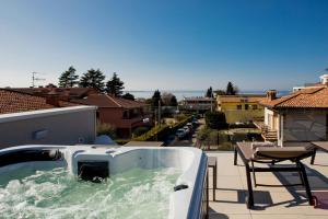 a hot tub on the roof of a house at Luxury House - Small Heated Pool in Bardolino