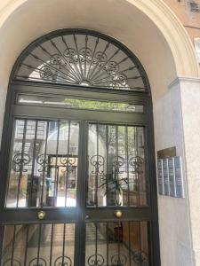an entrance to a building with a black door at La perla del Colosseo in Rome