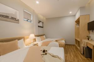 Voodi või voodid majutusasutuse Gia Nguyễn Hotel Dalat toas